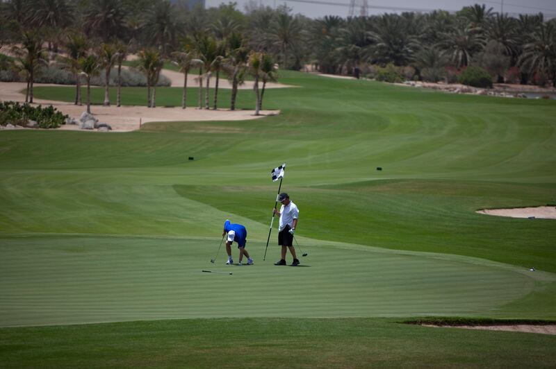 Abu Dhabi, United Arab Emirates, May 10, 2012:   
Golfers finish off their game at the course at the Abu Dhabi Golf Club on Thursday, May 10, 2012, at the Abu Dhabi Golf Club. (Silvia Razgova / The National)
