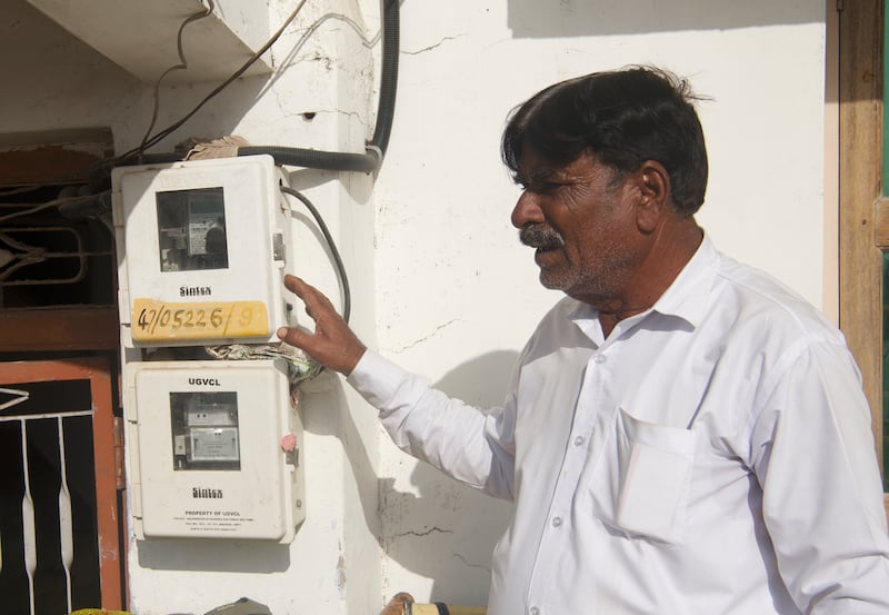 Pathan Sikandar Khan, a farmer in Modhera, shows us the electricity meter at his home