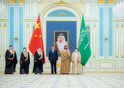 Saudi Crown Prince Mohammed Bin Salman stands with Chinese President Xi Jinping in Riyadh, Saudi Arabia, on December 8. SPA/Reuters