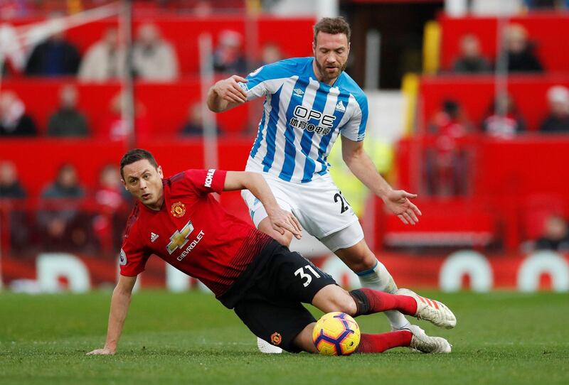 Manchester United's Nemanja Matic in action with Huddersfield Town's Laurent Depoitre. Reuters