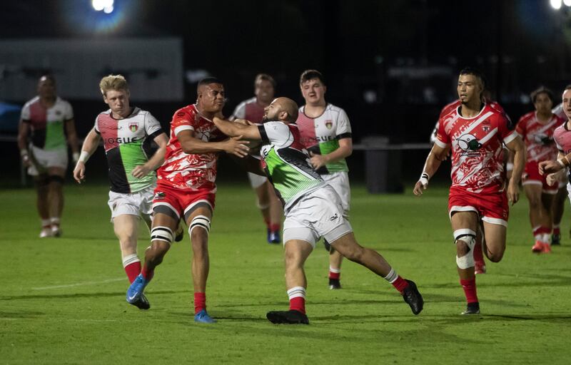 Abu Dhabi Harlequins and Dubai Tigers players compete during the match.