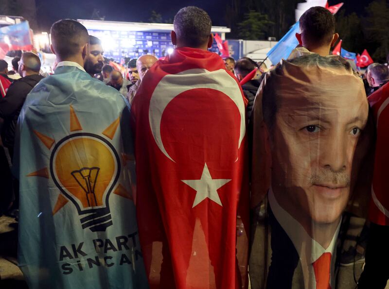 Supporters of Turkish President Recep Tayyip Erdogan outside the AK Party headquarters in Ankara on Sunday. AFP