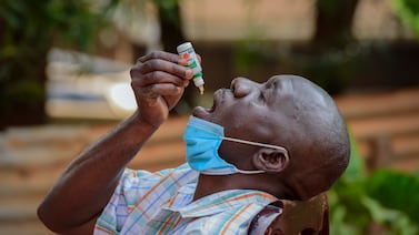 A man takes herbal medication for Covid-19 in Kampala, Uganda, in 2021. The pandemic led to vaccine inequity around the world. AP