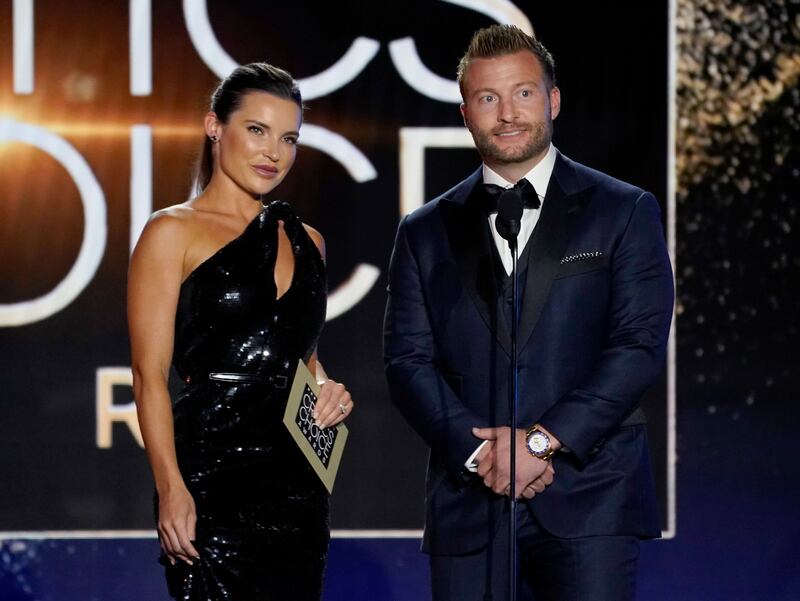 Veronika Khomyn, left, and Sean McVay present the award for Best Picture. AP