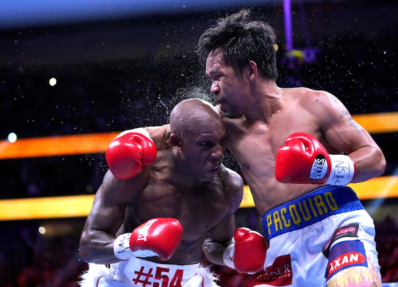 Manny Pacquiaoand Yordenis Ugas during the fight. Reuters