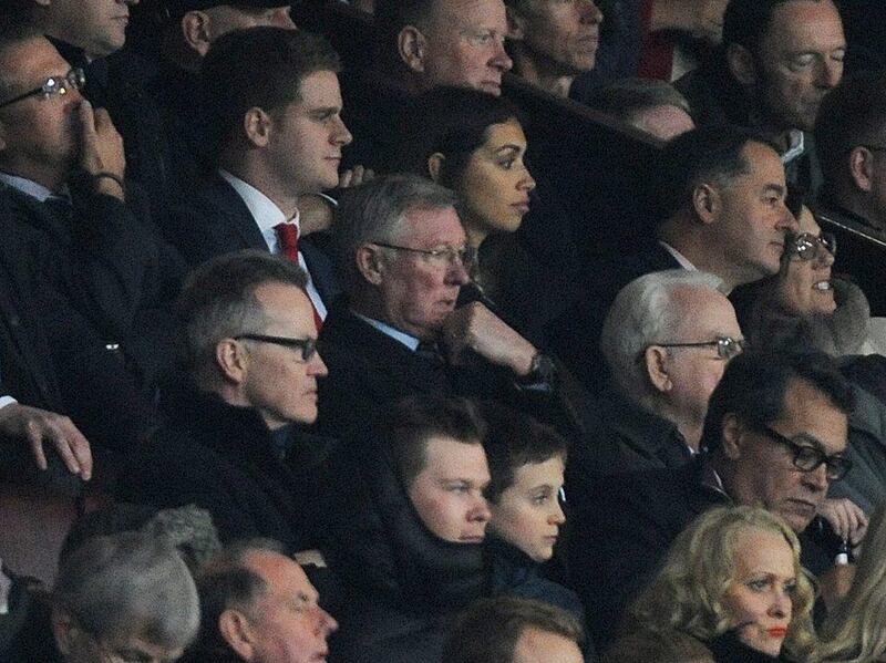 Former Manchester United manager Sir Alex Ferguson watches the United's 3-0 loss to Manchester City on Tuesday night at Old Trafford. Peter Powell / EPA / March 25, 2014