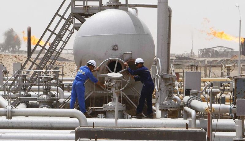 Workers of South Oil Company (SOC) adjust a valve at the Rumaila oil field in Basra Province. North Sea Brent rose to its highest point in about nine months. Atef Hassan / Reuters
