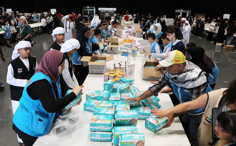 Volunteers preparing aid packages as part of the Compassion for Gaza campaign at the Festival City Arena in Dubai. All photos: Pawan Singh / The National