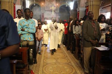 epa08089783 Christians attend a Christmas Mass at St. Matthew's Cathedral Church in Khartoum, Sudan, 25 December 2019. EPA/MARWAN ALI