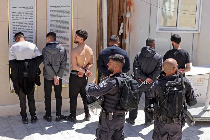 Israeli security forces detain Palestinian youths after a violent confrontation at the mosque. AFP