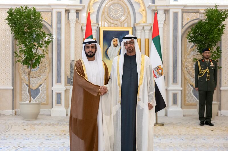 President Sheikh Mohamed stands for a photograph with Mr Al Ameri, ambassador to Bahrain