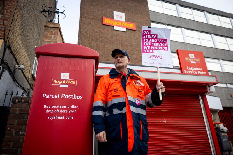 Royal Mail staff join a Communication Workers Union strike outside a post office in London. EPA
