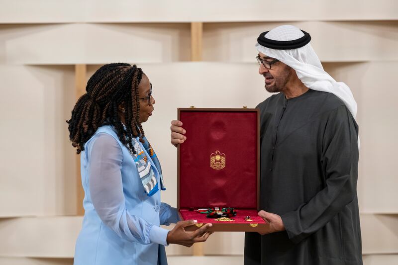 Sheikh Mohamed presents the First Class Order of Zayed II medal to Dr Vera Songwe, chairwoman and founder of the Liquidity and Sustainability Facility. Abdulla Al Neyadi / Presidential Court 
