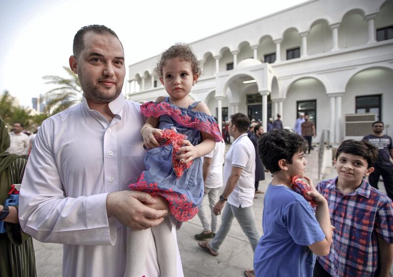 Abu Dhabi, United Arab Emirates, August 11, 2019.  Eid prayers at Zayed The 2nd Mosque.  Friends and relatives great one another after Eid prayers.
Victor Besa/The National
Section:  NA
Reporter: Haneen Dajani