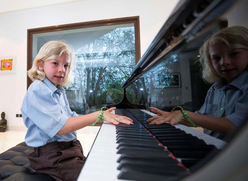 DUBAI, UNITED ARAB EMIRATES, 22 April 2018 - Claudius Tyacke, seven year old who won first prize in a piano competition in Paris in  his residence in Dubai.  Leslie Pableo for The National