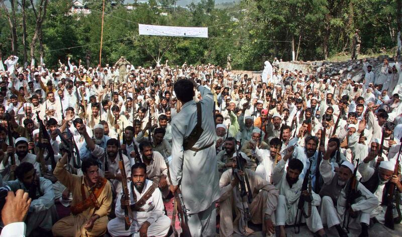 Armed Pakistani militiamen gather in the former Taliban stronghold area of Puchar in Swat valley on September 14, 2009. AFP