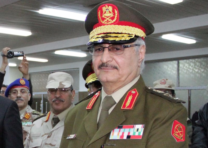 (FILES) This file photo taken on March 9, 2015 in the eastern Libyan city of Tobruk shows Libyan anti-Islamist General Khalifa Haftar attending his swearing in ceremony as the new self-styled Libyan National Army chief.
Libyan military strongman Khalifa Haftar's chief of staff said on April 18, 2018 that he survived a car bombing in the eastern city of Benghazi, adding in a brief statement that he "escaped unharmed from a terrorist assassination attempt after a car bomb exploded... as his convoy passed".
The attack comes after Haftar, who supports a parliament based in the far east of Libya, was in hospital in Paris last week after falling ill during a trip abroad. / AFP PHOTO / STR