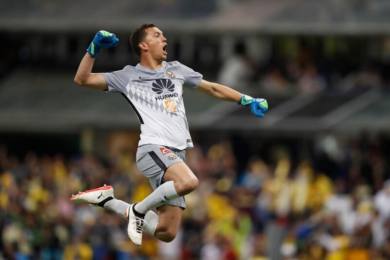 American goalkeeper Agustin Marchesin celebrates after his teammate Cecilio Dominguez scores the side's second goal against Cruz Azul in Mexico City. Eduardo Verdugo / AP Photo