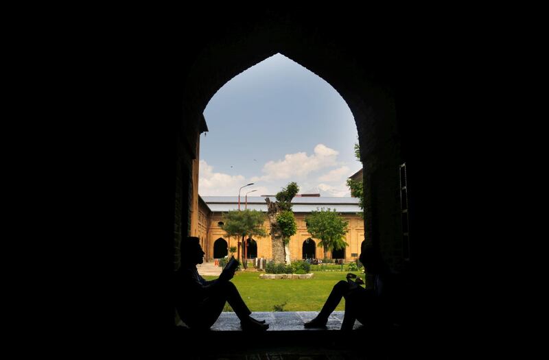 Kashmiri Muslims recite the Quran on the first day of fasting month of Ramadan inside Jamia Masjid (Kashmir's Grand Mosque) in Srinagar, the summer capital of Indian Kashmi.   EPA