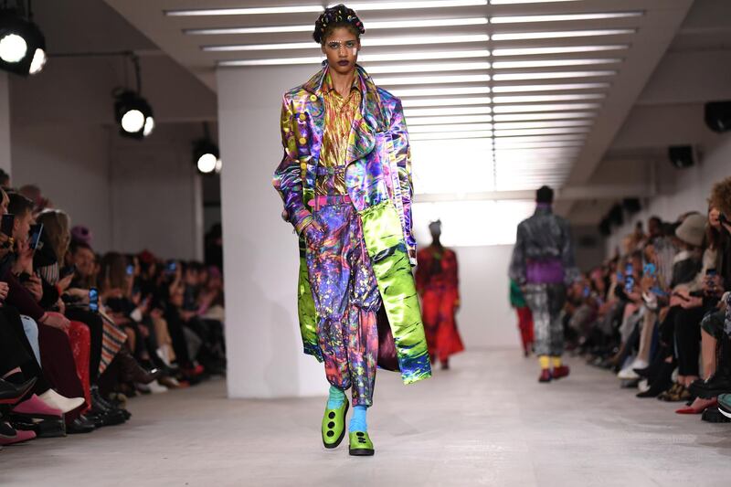 Models present creations during the On/Off catwalk show for their Autumn/Winter 2020 collection on the first day of London Fashion Week in London on February 14, 2020. (Photo by DANIEL LEAL-OLIVAS / AFP)