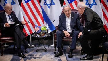 Israeli Prime Minister Benjamin Netanyahu confers with his war cabinet Defence Minister Yoav Gallant, right, during a meeting with US President Joe Biden in Tel Aviv, in October last year. AFP