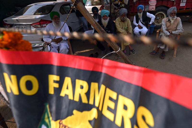 Farmers have continued to protest despite the pledge to repeal the laws. AFP