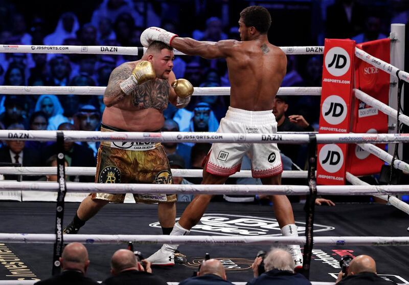 Defending champion Andy Ruiz Jr takes a punch during his fight against Britain's Anthony Joshua. AP