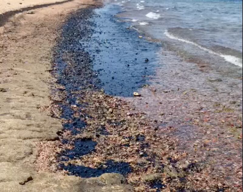 Oil on the southern shore of the Jordanian port city of Aqaba after a spill Jordanian authorities say came from an Egyptian-owned ship moored in the port. The National