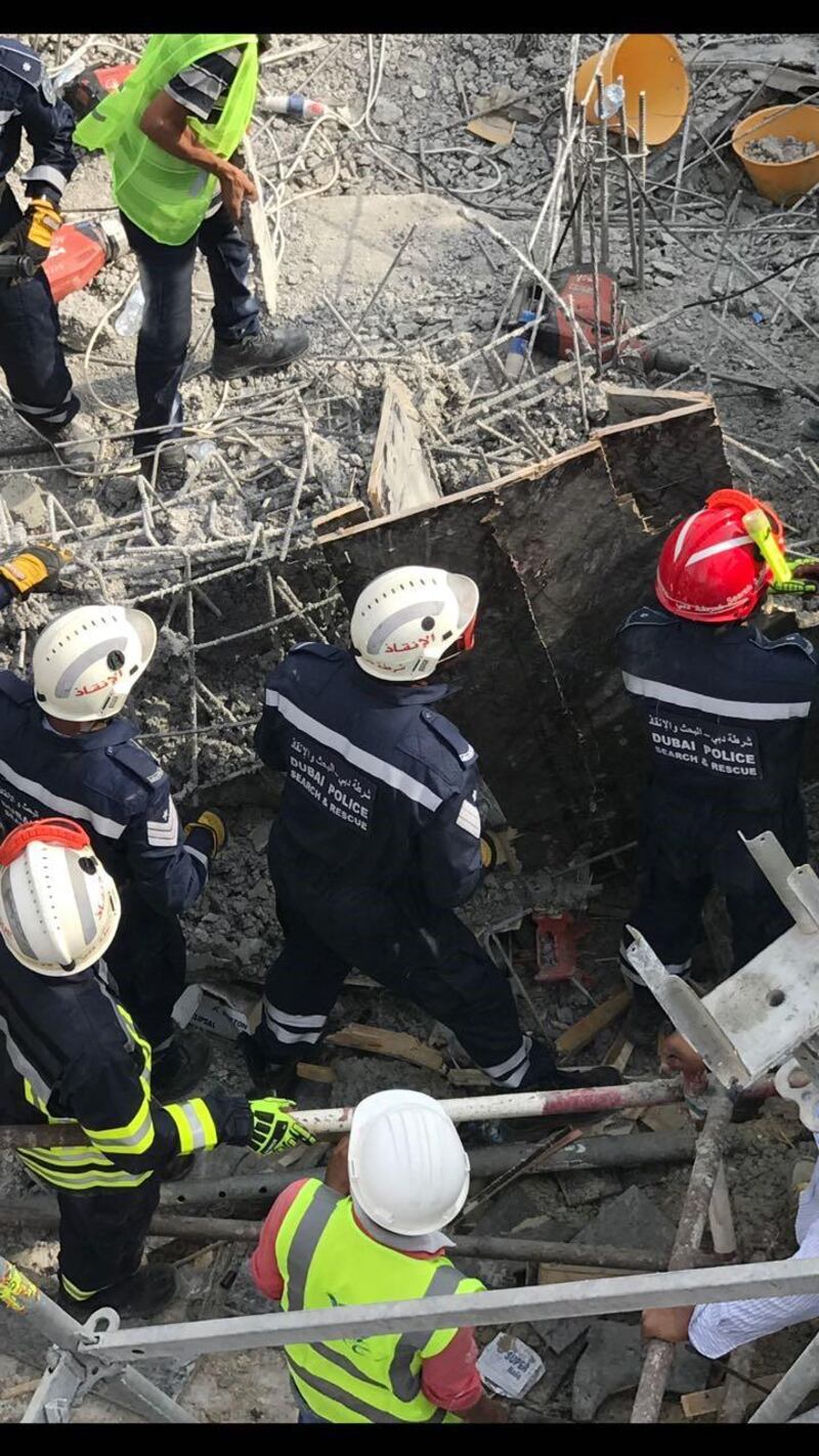 Rescuers tried for hours to find the man trapped underneath the rubble but when they did he was dead. Courtesy Dubai Police