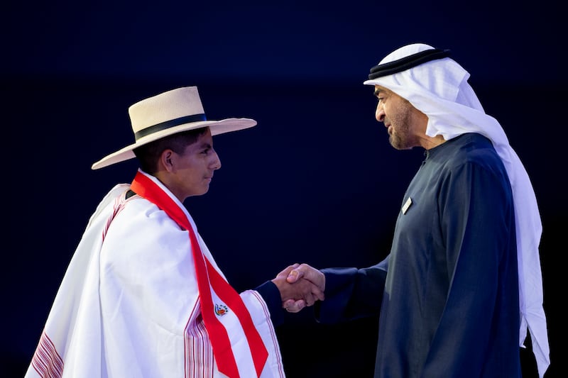 President Sheikh Mohamed shakes hands with prize winner, Victor Sanchez Gutierrez.