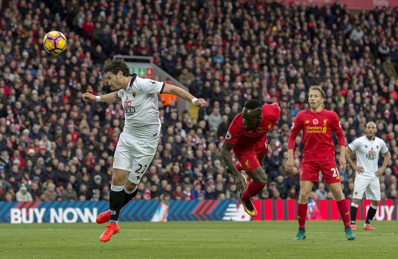 Liverpool’s Sadio Mane scores the opening goal against Watford. Peter Powell / EPA