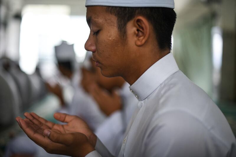 A Muslim student recites a prayer in Bentong, outside Kuala Lumpur.  AFP