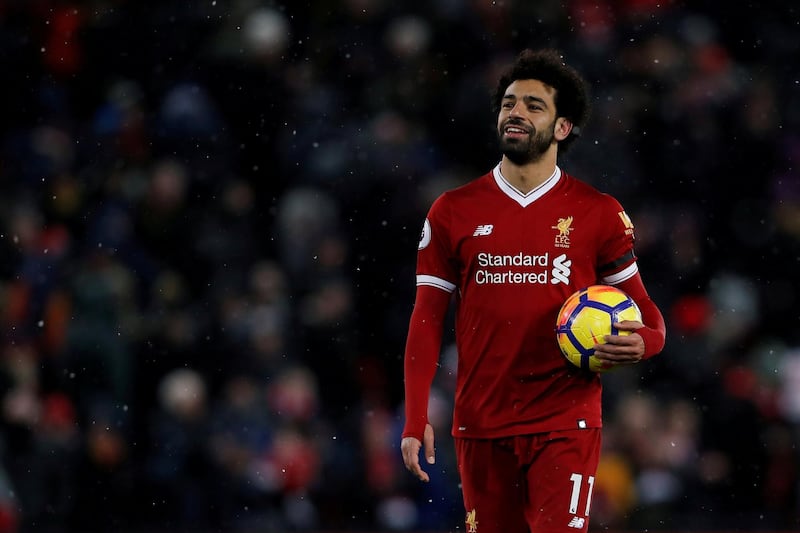 Soccer Football - Premier League - Liverpool vs Watford - Anfield, Liverpool, Britain - March 17, 2018   Liverpool's Mohamed Salah celebrates with the match ball after the match    Action Images via Reuters/Lee Smith    EDITORIAL USE ONLY. No use with unauthorized audio, video, data, fixture lists, club/league logos or "live" services. Online in-match use limited to 75 images, no video emulation. No use in betting, games or single club/league/player publications.  Please contact your account representative for further details.     TPX IMAGES OF THE DAY