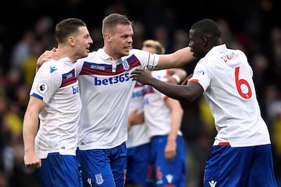 Soccer Football - Premier League - Watford vs Stoke City - Vicarage Road, Watford, Britain - October 28, 2017   Stoke City's Ryan Shawcross celebrates with Kevin Wimmer and Kurt Zouma at the end of the match    Action Images via Reuters/Tony O'Brien    EDITORIAL USE ONLY. No use with unauthorized audio, video, data, fixture lists, club/league logos or "live" services. Online in-match use limited to 75 images, no video emulation. No use in betting, games or single club/league/player publications. Please contact your account representative for further details.?