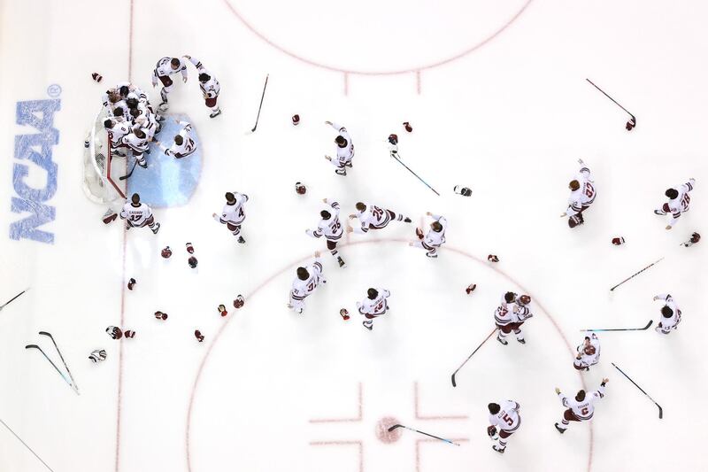 The Massachusetts Minutemen celebrate after winning the Division One Men's Ice Hockey Championship 5-0 against the St Cloud State Huskies in Pittsburgh, Pennsylvania. AFP