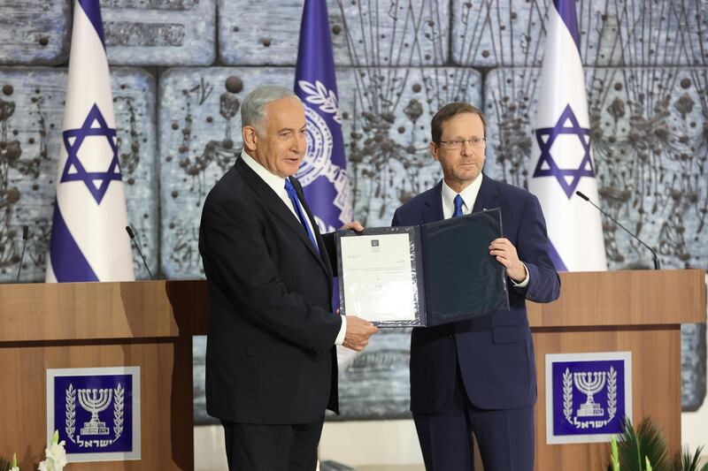 Israeli president Isaac Herzog delivers elected Israeli prime minister Benjamin Netanyahu the task to form a new government at the president residence in Jerusalem. EPA