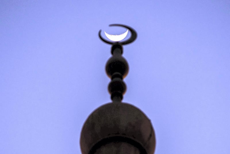 Abu Dhabi, United Arab Emirates, April 17, 2021.   The crescent moon shows itself at the Sheikh Zayed Bin Sultan Al Nahyan Mosque at Al Bahia, Abu Dhabi.
Victor Besa/The National
Section:  NA/Stand Alone/Stock Images