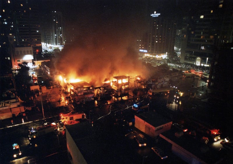 This image taken in 2003 shows the fire which destroyed Abu Dhabi's original souk, popularly known as the old souk or old central market. (Al Ittihad)  *** Local Caption ***  Abu Dhabi Souk Fire009.jpg