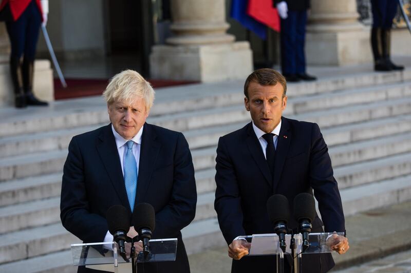 Emmanuel Macron, France's president, right, speaks beside Boris Johnson, U.K. prime minister, as they deliver statements in the courtyard of Elysee Palace in Paris, France, on Thursday, Aug. 22, 2019. Macron gave Johnson little hope he’s prepared to compromise on Brexit and said any changes to the current deal won’t be very significant. Photographer: Jeanne Frank/Bloomberg