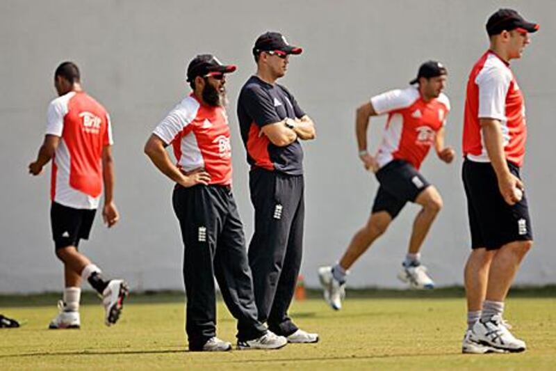 England's spin bowling coach, Mushtaq Ahmed, left, and team coach Andy Flower supervise bowling practise at the nets in Nagpur yesterday.
