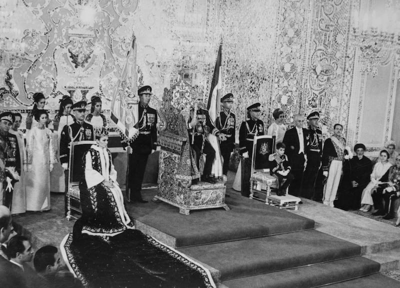 The Shah, his wife and son wear royal insignia in Tehran, in November 1967. Getty Images