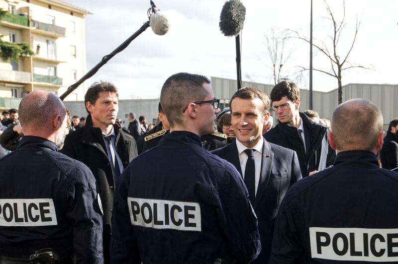 French President Emmanuel Macron meets police officers during a visit to the police station in the district of Bourtzwiller, in Mulhouse, France February 18, 2020. Sebastien Bozon/Pool via REUTERS