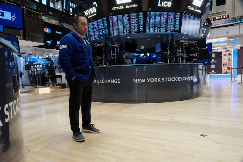 Traders are seen on the floor of the New York Stock Exchange. Investors are pondering their next moves as the US Federal Reserve is poised to once again raise interest rates in November. AFP