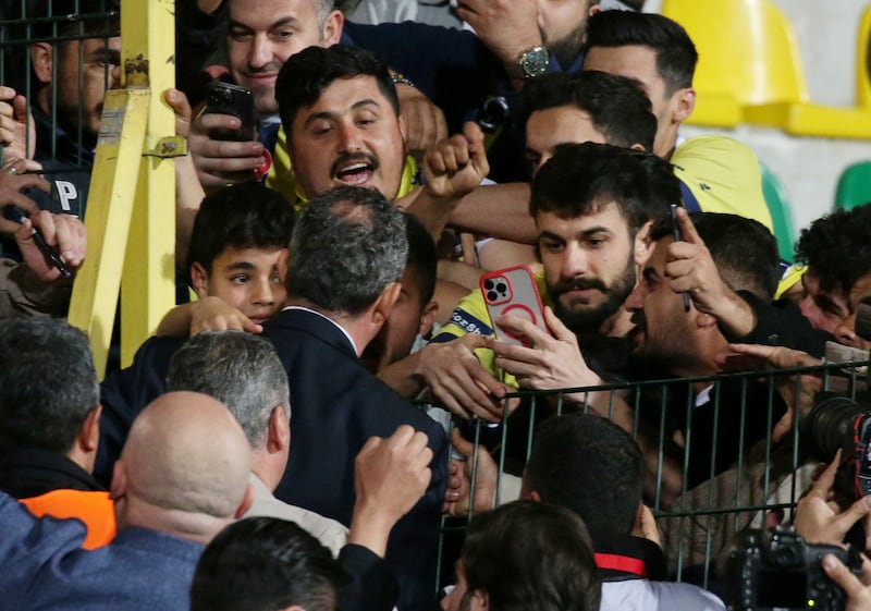 Fenerbahce President Ali Koc with fans in the stands. Reuters