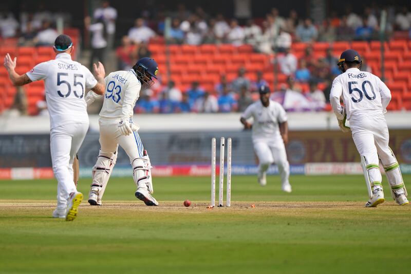 India's Jasprit Bumrah looks at the stumps after being bowled out by England spinner Joe Root. AP