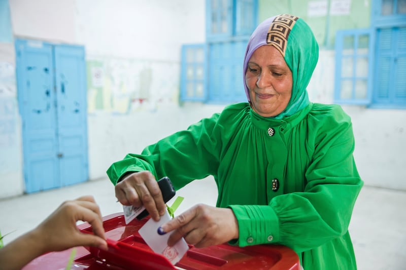 A woman casts her vote at a polling station in Tunis. AP 