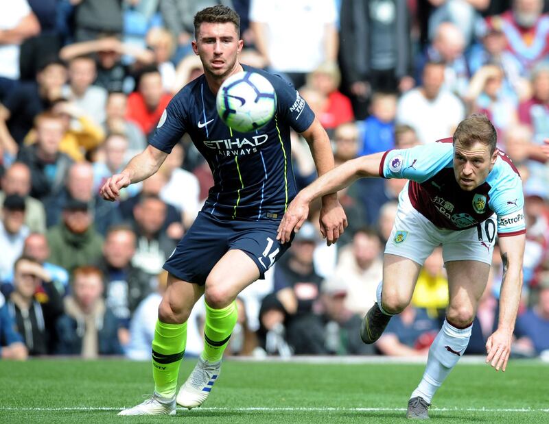 Aymeric Laporte duels for the ball with Burnley's Ashley Barnes. AP Photo