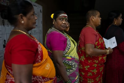 Women queue up to cast their votes during the first round of polling of India’s national election in Chennai, southern Tamil Nadu state. AP
