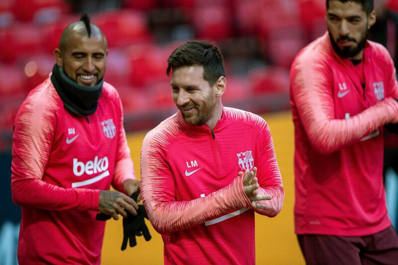 Barcelona's Lionel Messi, center,  during the training session at Old Trafford, Manchester. AP