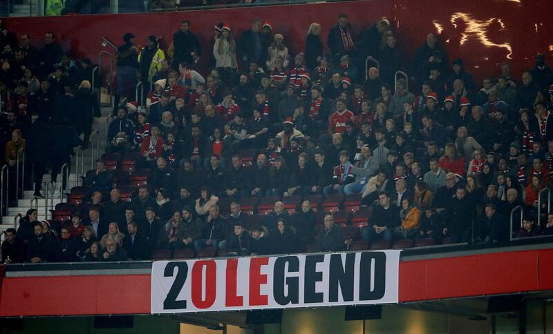 Soccer Football - Premier League - Manchester United v Huddersfield Town - Old Trafford, Manchester, Britain - December 26, 2018  Fans with a banner in reference to Manchester United interim manager Ole Gunnar Solskjaer     Action Images via Reuters/Jason Cairnduff  EDITORIAL USE ONLY. No use with unauthorized audio, video, data, fixture lists, club/league logos or "live" services. Online in-match use limited to 75 images, no video emulation. No use in betting, games or single club/league/player publications.  Please contact your account representative for further details.